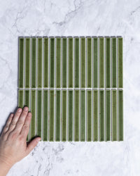 Sapporo Olive Green Speckle Japanese Hand Glazed Finger Mosaics 15x148mm tile, view 1 - Tile Touch